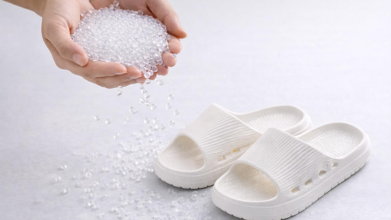 alt="EVA pellets and white EVA slide slippers showing EVA material for slipper manufacturing"