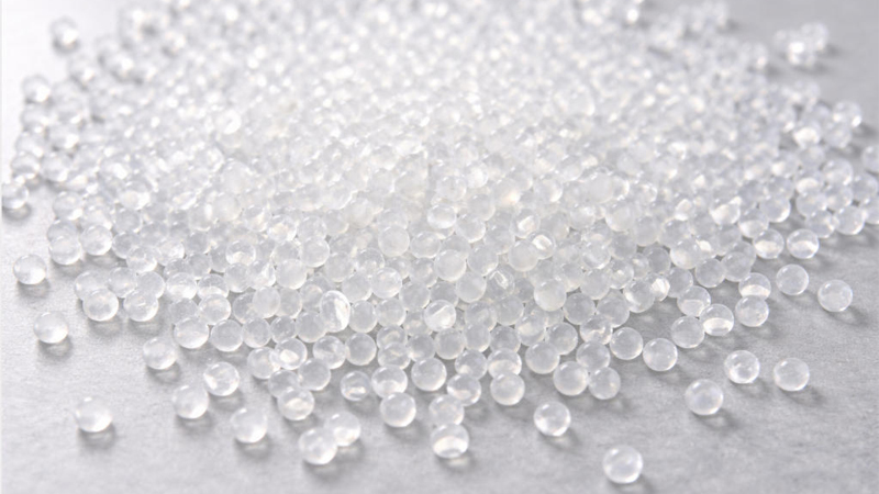 alt="Close-up of EVA pellets showing raw EVA material used in EVA slipper manufacturing"