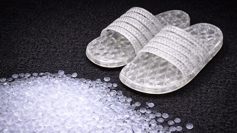 alt="PVC slippers in different colors showing common PVC material applications in slipper manufacturing"