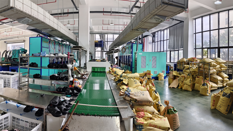 Slipper manufacturing workshop producing PU and EVA slippers with molding machines and raw materials