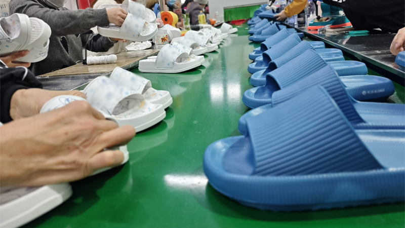 Bathroom slipper production line with PVC and rubber styles being assembled and inspected for bulk orders