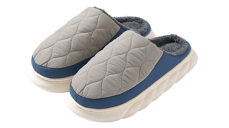 alt="Close-up of fabric and plush slipper materials showing softness warmth and indoor comfort properties"