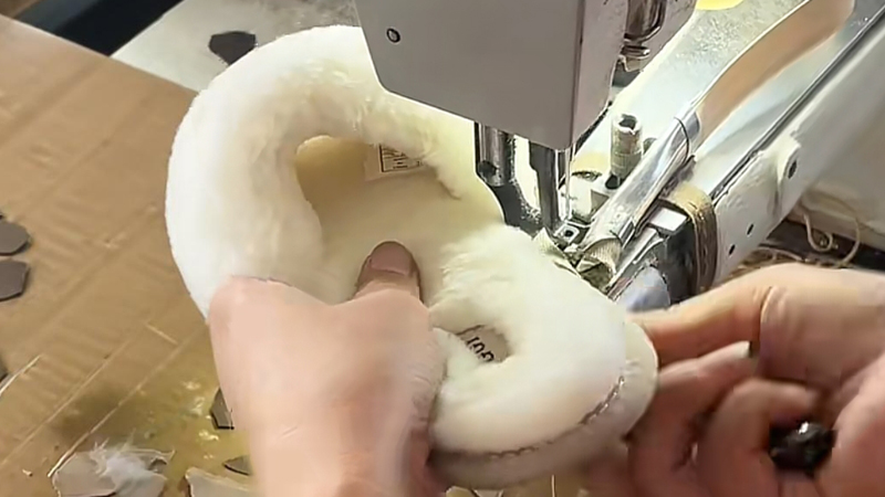 alt="Fabric and plush slipper manufacturing process showing stitching "