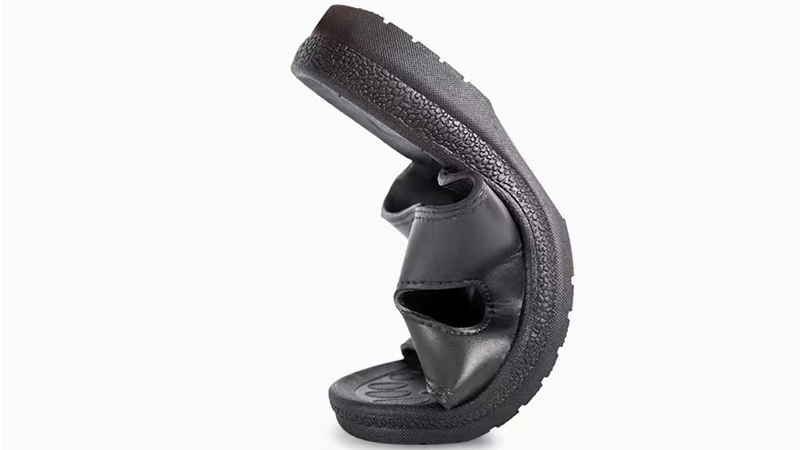 alt="PU indoor slippers showing premium texture and cushioned sole feel for everyday home use"