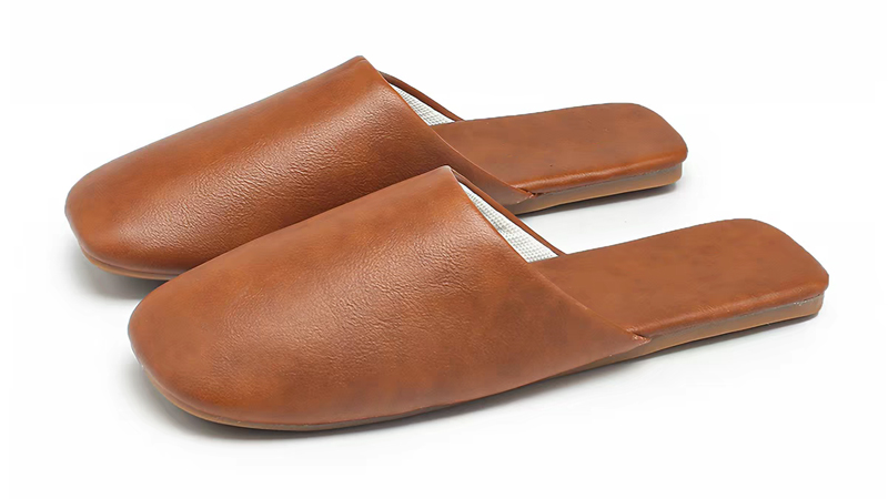 PU slippers showing leather-like texture and premium design positioning for fashion and private label brands