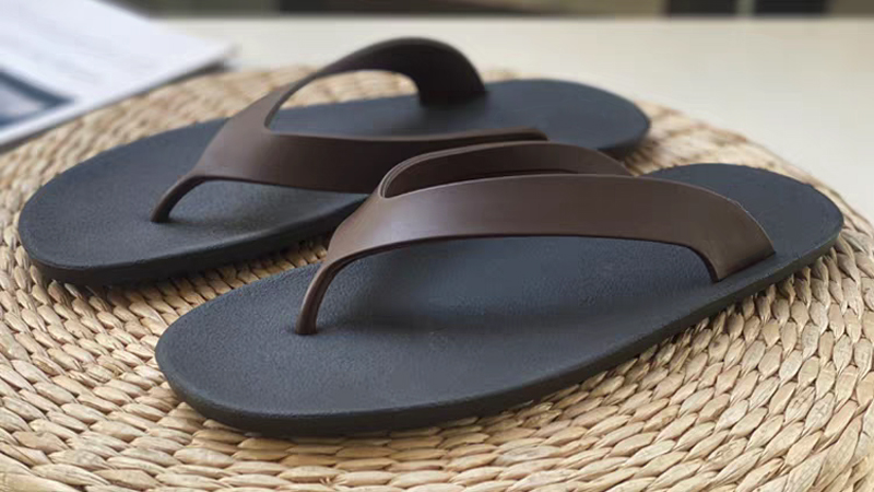 Rubber bathroom slippers with crossed straps showing durable construction and stable grip for wet areas
