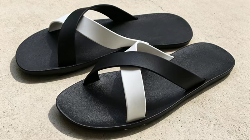 Rubber sole slippers with crossed straps showing durable construction for casual and outdoor wear